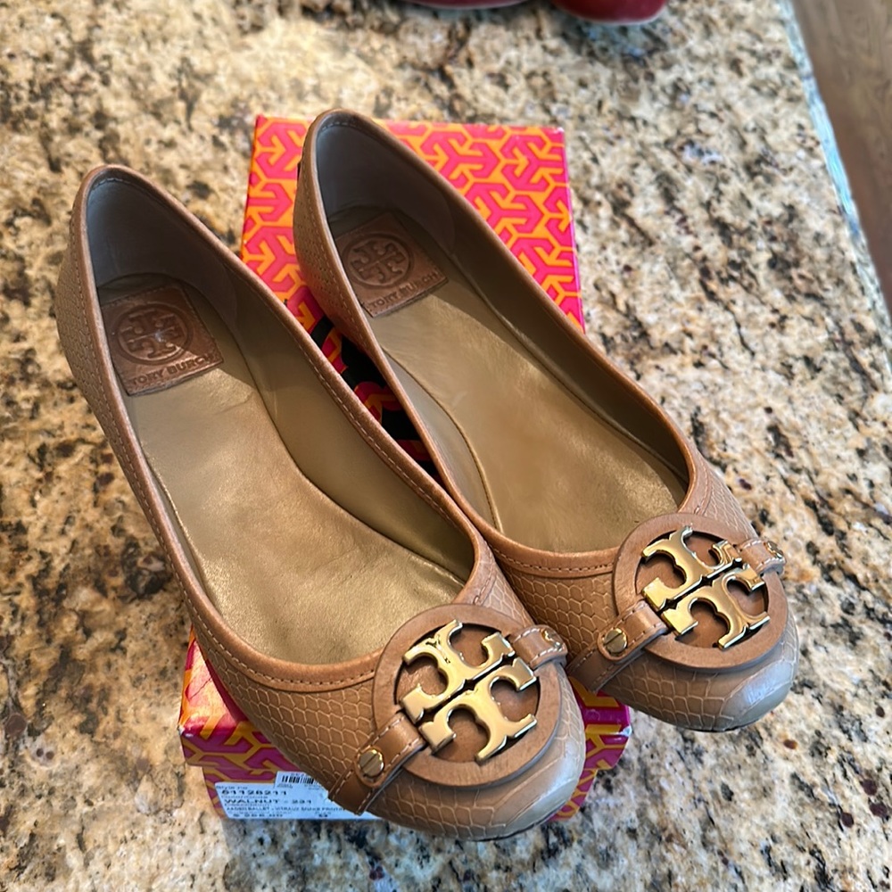 Tory Burch walnut flat shoes. Gold “T” on toe.